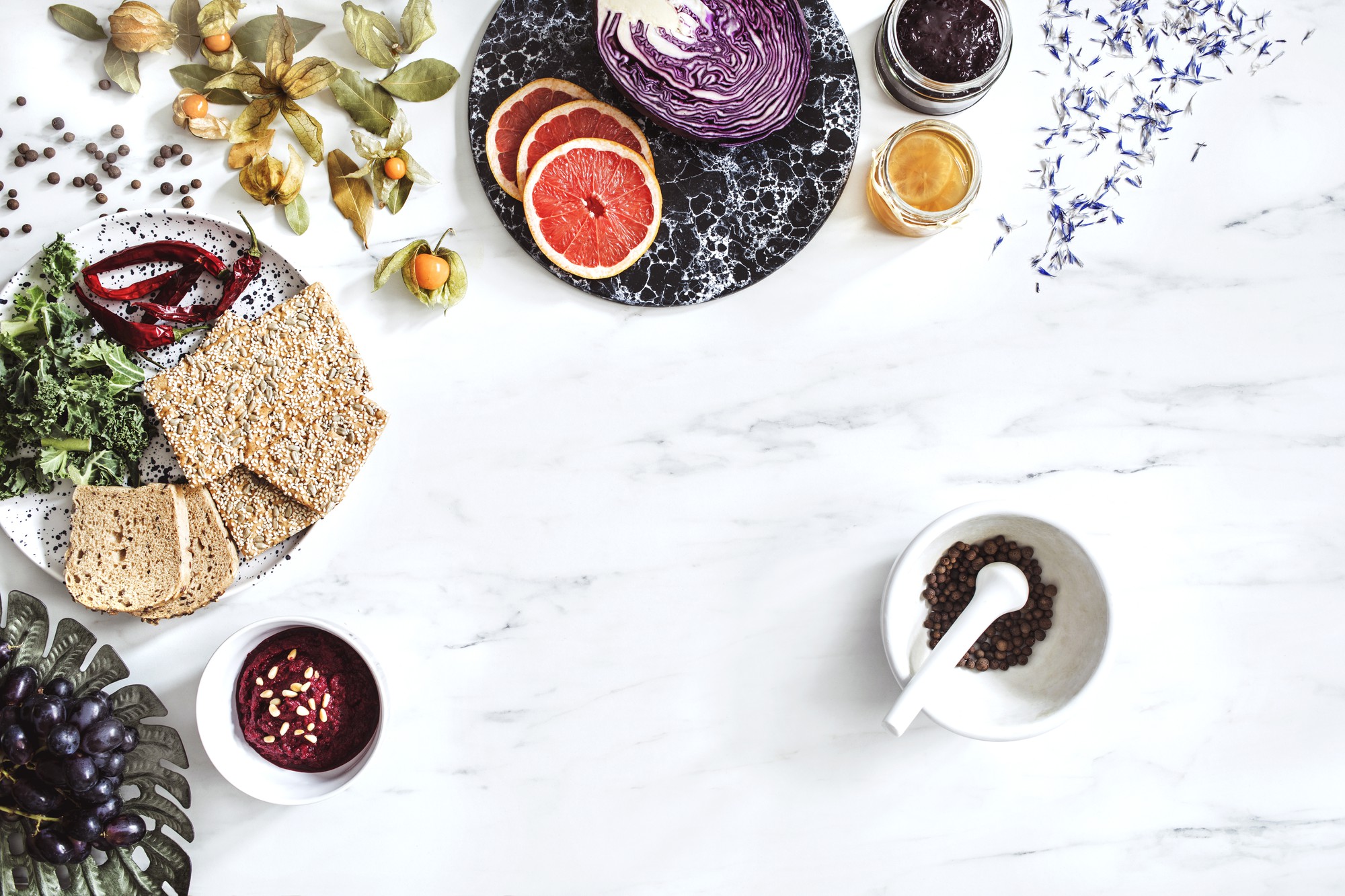 Overhead of composed breakfast board with herbs